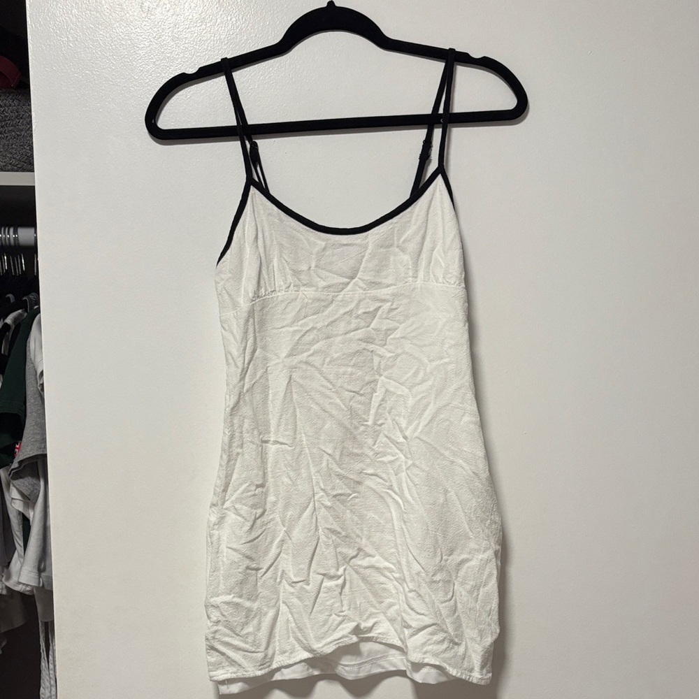 White linen mini dress with black piping